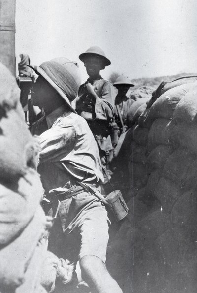 Soldier looking through a trench periscope, from an album compiled by Lt. Kindom by English Photographer